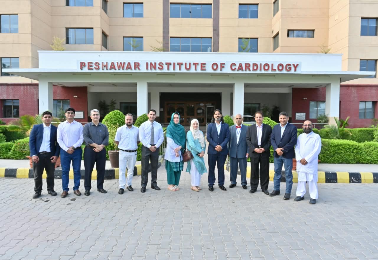 ClinRé Foundation and Peshawar Institute of Cardiology representatives outside the PIC hospital building