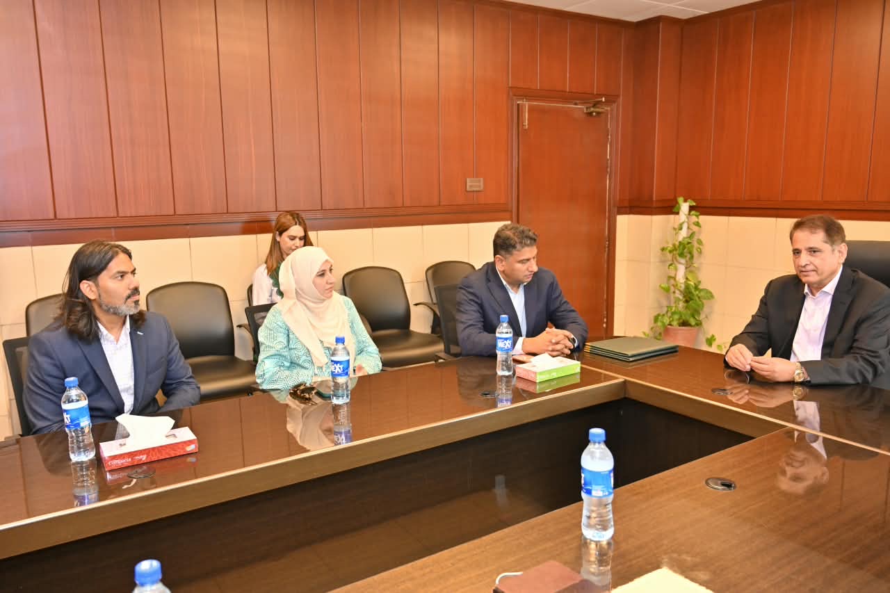 ClinRé Foundation delegation in discussion with PIC leadership in a conference room